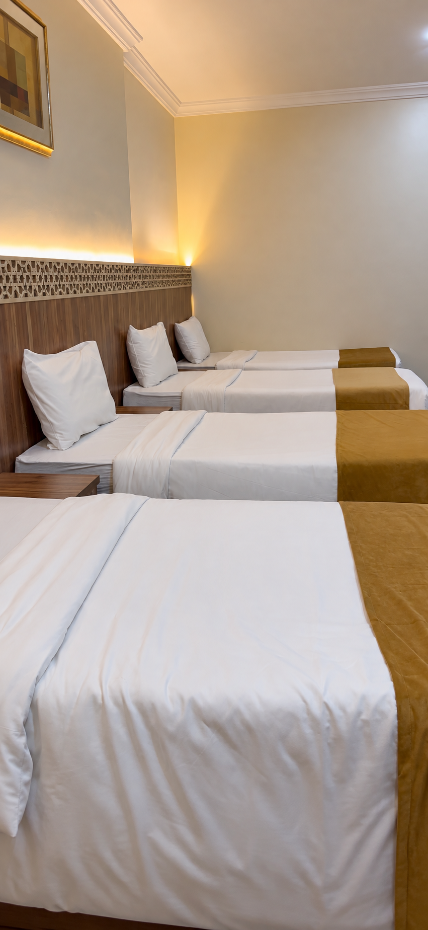 Manazel Al Furqan 2 Hotel — Oda ve yatakların genel görünümü